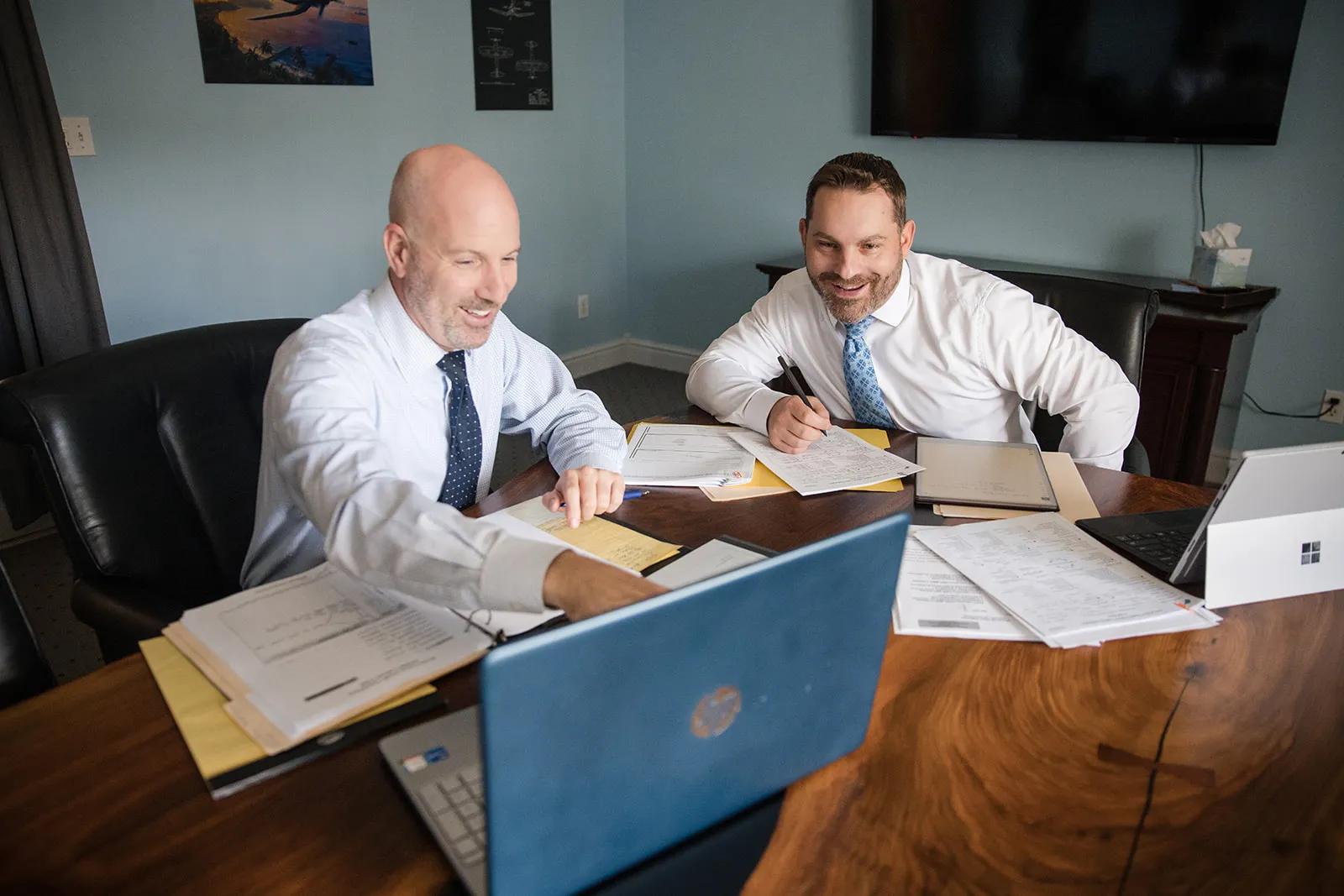 Polverini & Wiater attorneys reviewing a case at the office